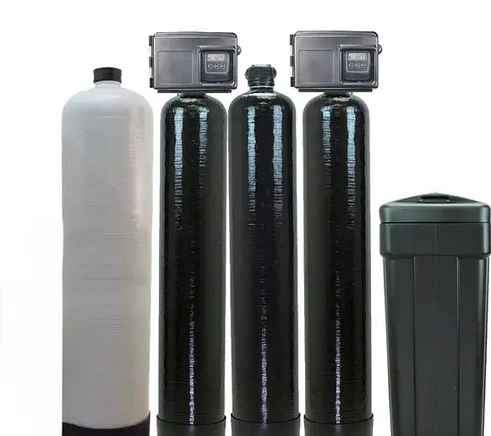 Cesare's custom water treatment system lineup with media tanks and brine tank